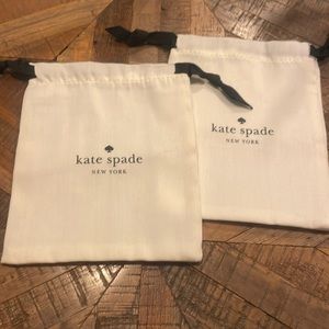 Pair of white Kate spade dust bags